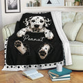 Dalmatian puppy throw blanket draped over a sofa with black and white spotted artwork