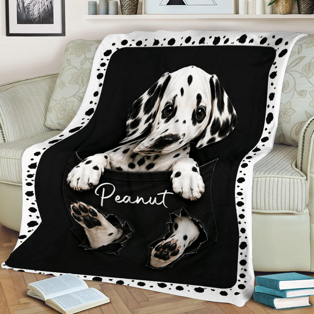 Close view of a spotted Dalmatian puppy blanket displayed on a sofa