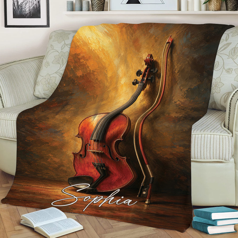 Artistic violin and bow blanket draped across a sofa in a warm music-inspired setting