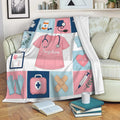 Nurse throw blanket draped over a sofa with colorful scrubs, medical tools, gloves, and healthcare-themed artwork