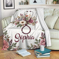 Floral nurse blanket displayed on a sofa with stethoscope artwork and botanical accents