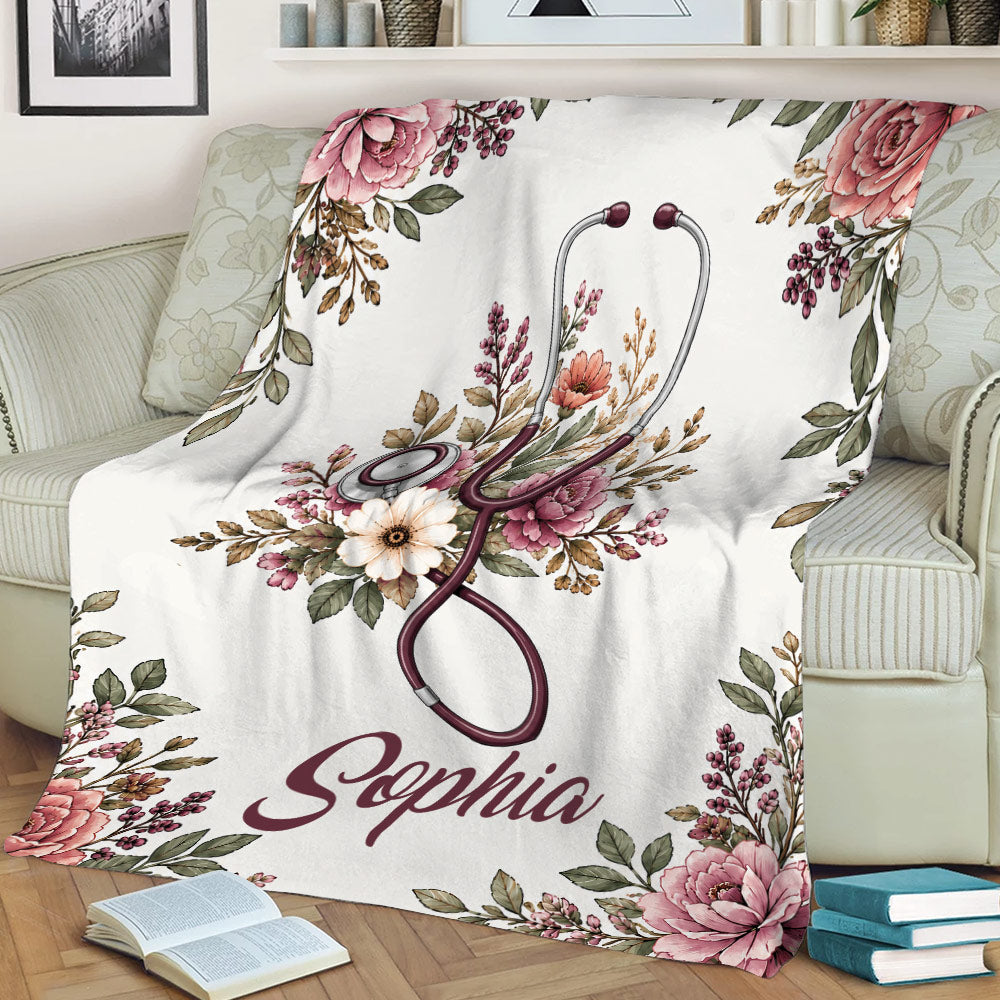 Nurse throw blanket draped over an armchair with floral stethoscope artwork