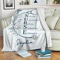 Nurse blanket displayed on a sofa with stethoscope artwork, floral details, and an inspirational design