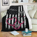 Nurse blanket draped over a sofa with stethoscope artwork and bold black, white, and pink colors