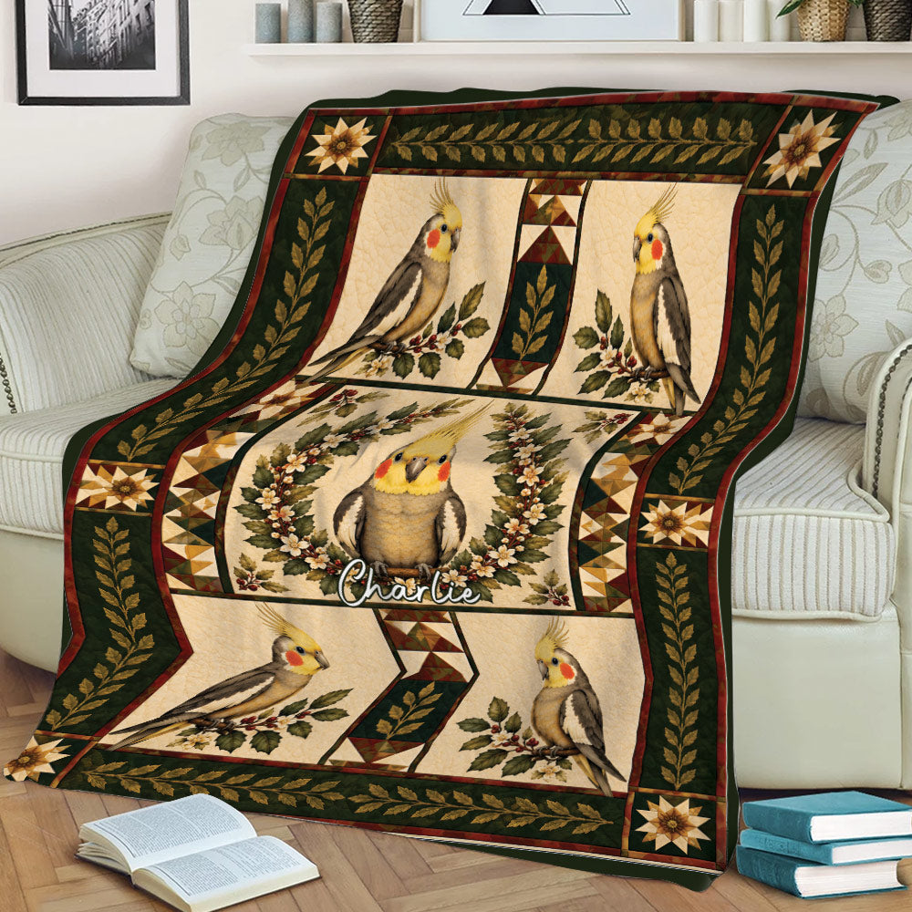 Cockatiel throw blanket displayed on a couch with colorful birds, flowers, and leafy borders