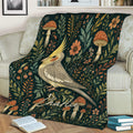 Cockatiel throw blanket displayed on a sofa with woodland mushrooms, flowers, and leafy botanical art