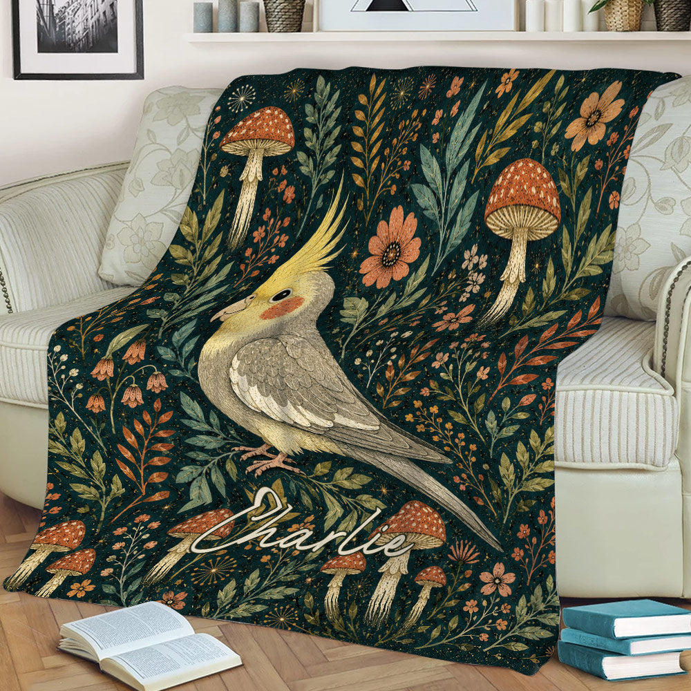 Cockatiel throw blanket displayed on a sofa with woodland mushrooms, flowers, and leafy botanical art