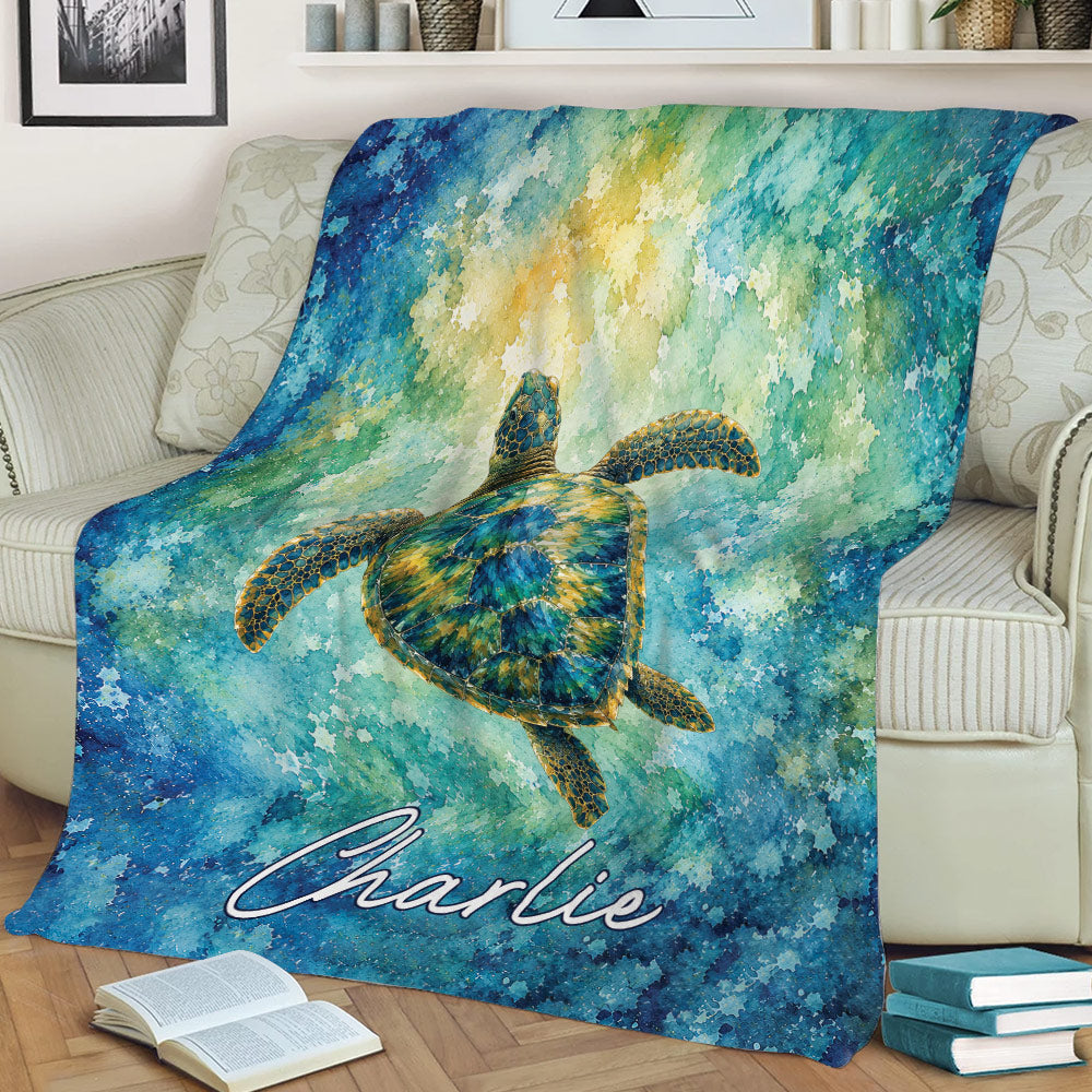 Colorful sea turtle throw blanket styled across a sofa with flowing watercolor ocean artwork
