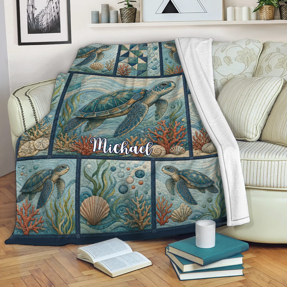 Sea turtle throw blanket draped over a sofa with coral reef and coastal ocean artwork