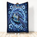 Blue sea turtle blanket with ocean waves, hibiscus flowers, bubbles, and deep navy artwork