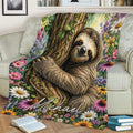 Sloth throw blanket displayed on a couch with detailed tree bark and colorful flower border
