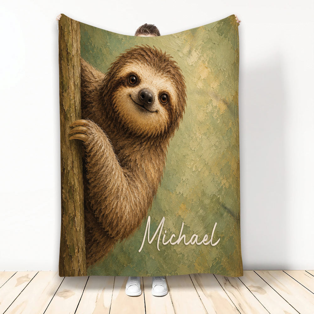 Sloth throw blanket displayed upright with a smiling woodland sloth artwork in earthy green and brown tones
