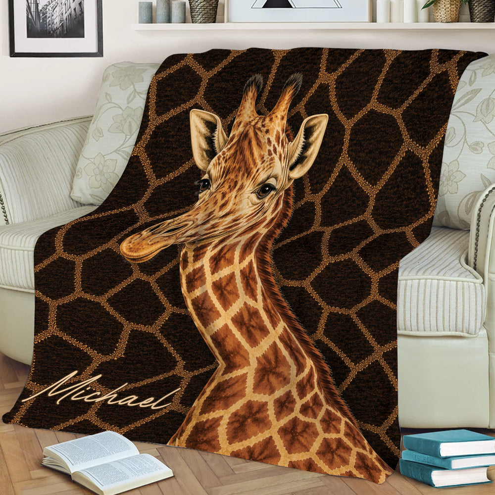 Giraffe blanket displayed on a chair with detailed wildlife artwork in warm brown tones