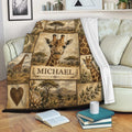 Giraffe blanket draped over a sofa, showing safari wildlife artwork in warm earthy tones
