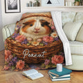 Guinea pig throw blanket draped over a sofa with colorful floral basket artwork