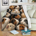 Guinea pig blanket draped over a sofa, featuring colorful cavy artwork in a cozy living room