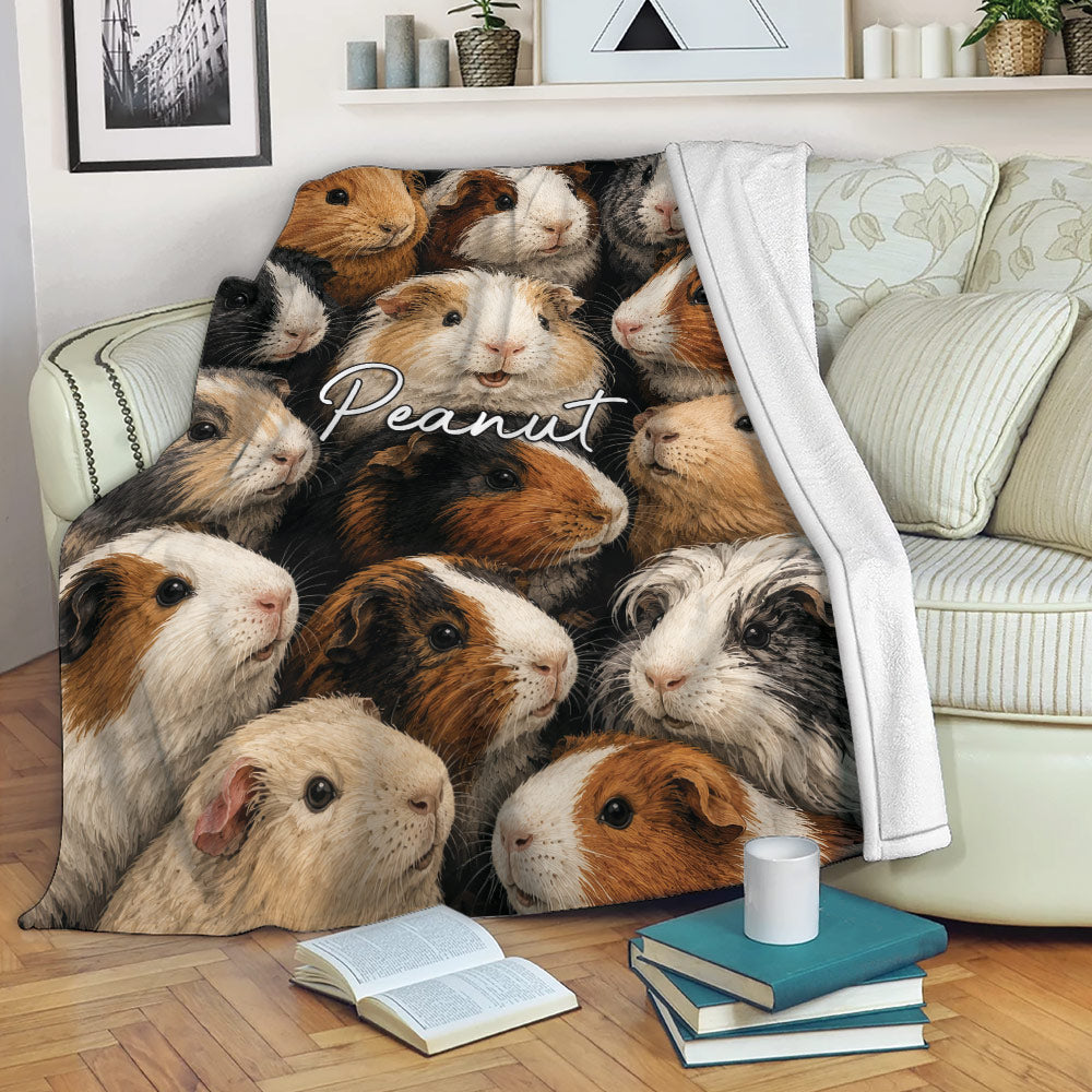 Guinea pig blanket draped over a sofa, featuring colorful cavy artwork in a cozy living room