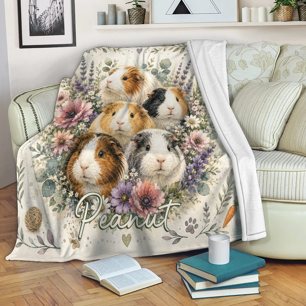 Floral guinea pig blanket displayed on a sofa with botanical artwork and cozy living room decor