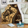 Rodeo bull riding throw blanket displayed on a sofa with cowboy, bull, hat, boots, and western artwork