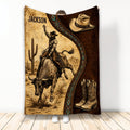 Rodeo throw blanket featuring a bull rider, cowboy hat, boots, desert scenery, and rustic western artwork
