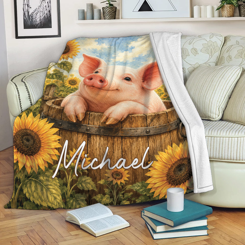 Pig throw blanket draped over a sofa with sunflower farm artwork and a cozy living room setting