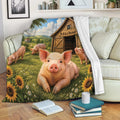 Pig throw blanket draped over a sofa, showing a cheerful pig, farm scene, barn, and sunflowers