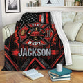 Firefighter blanket draped over a sofa with bold red and black fire service artwork and patriotic flag details