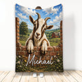 Goat throw blanket featuring a friendly horned goat, brick wall, wildflowers, and a sunny countryside farm scene