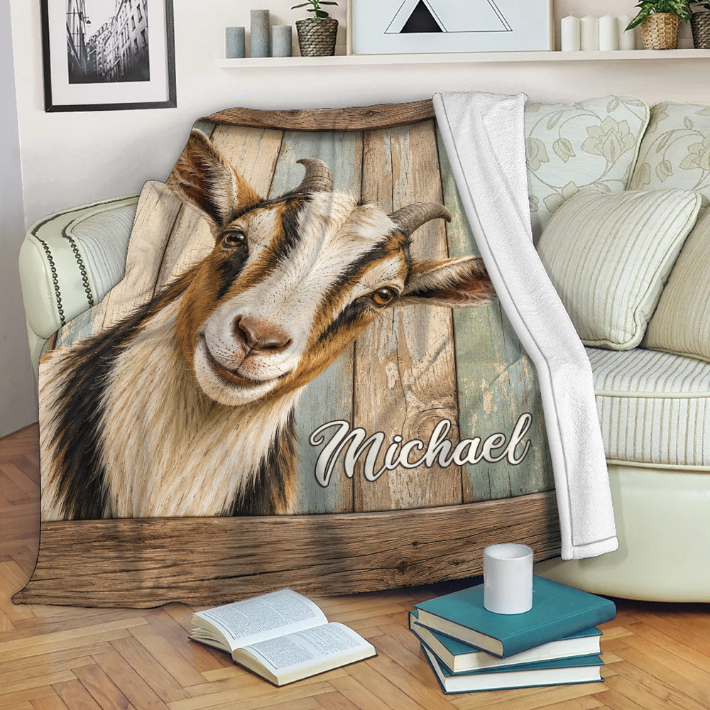 Goat throw blanket draped over a sofa with rustic wood artwork in a cozy living room