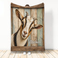 Rustic goat throw blanket displayed upright with a detailed goat portrait against weathered wood artwork
