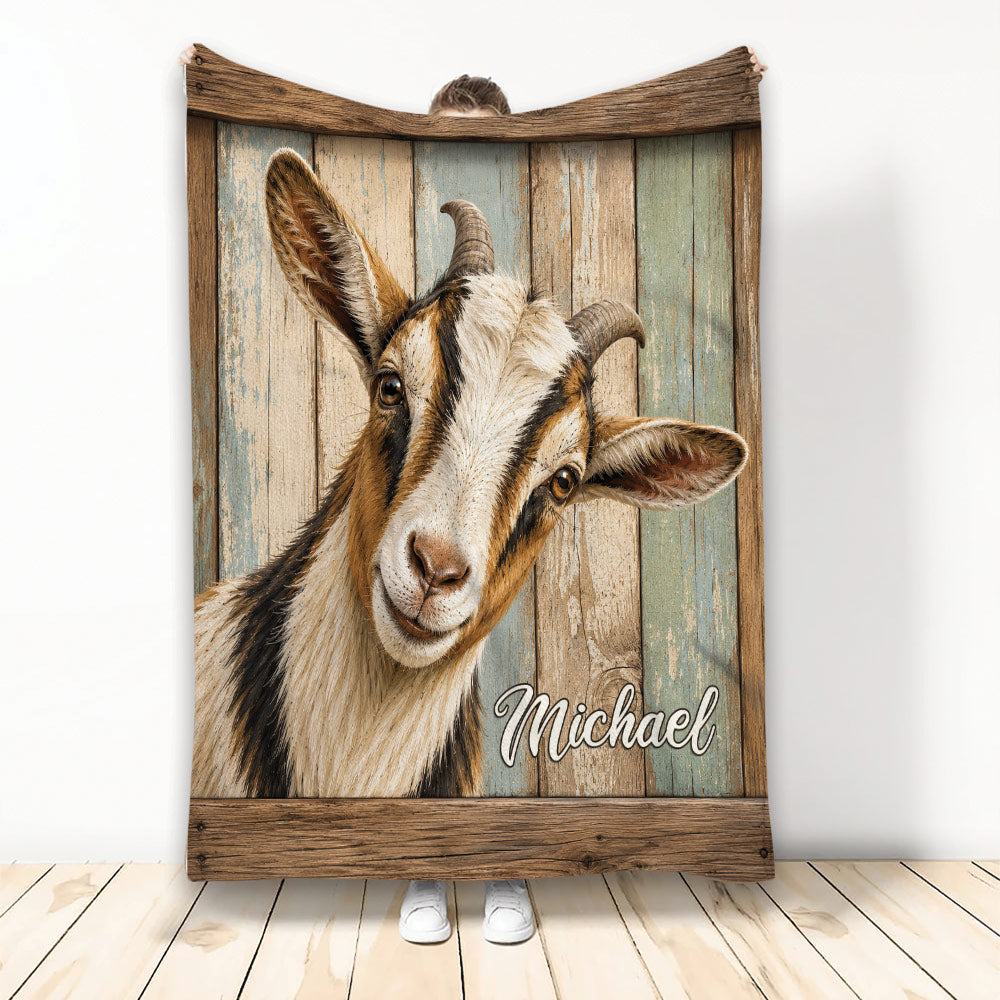 Rustic goat throw blanket displayed upright with a detailed goat portrait against weathered wood artwork