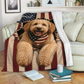 Labradoodle throw blanket displayed on a sofa with patriotic flag artwork and a cozy living room setting