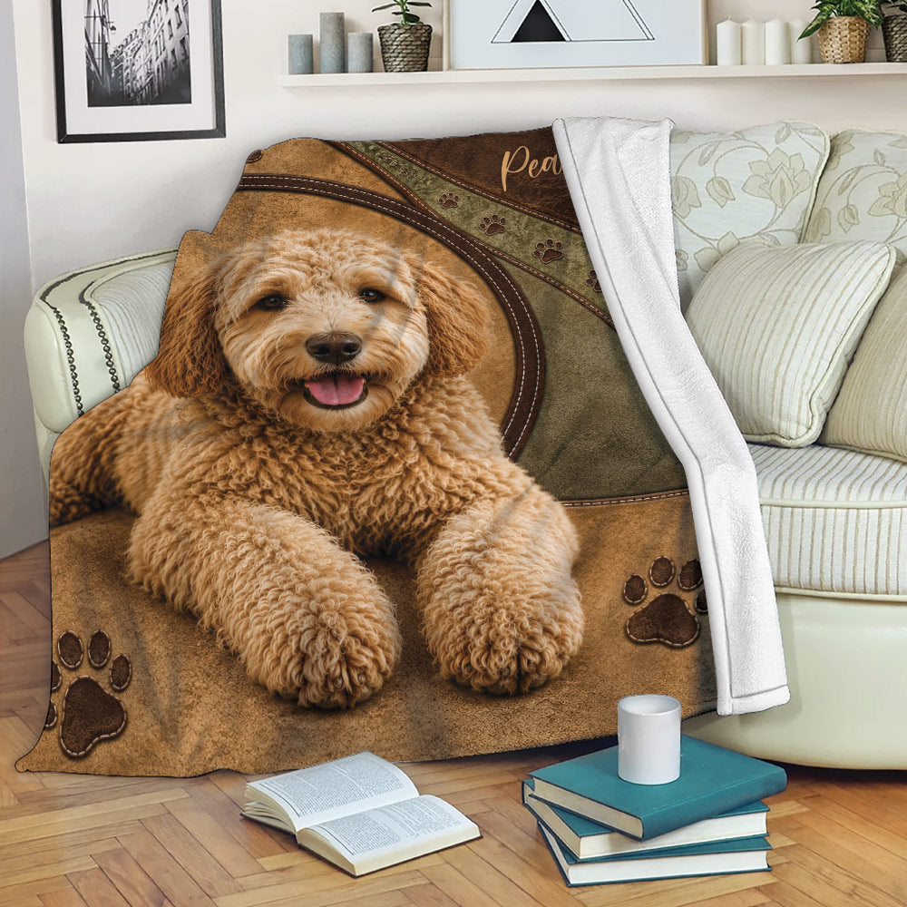 Labradoodle throw blanket draped across a sofa with a cozy dog-themed design