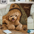 Labradoodle blanket displayed on a sofa with rustic leather-style accents and paw prints