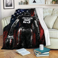 Patriotic American football blanket displayed on a sofa with a player and football design