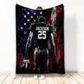 American football player holding a football against distressed red, white, and blue flag artwork