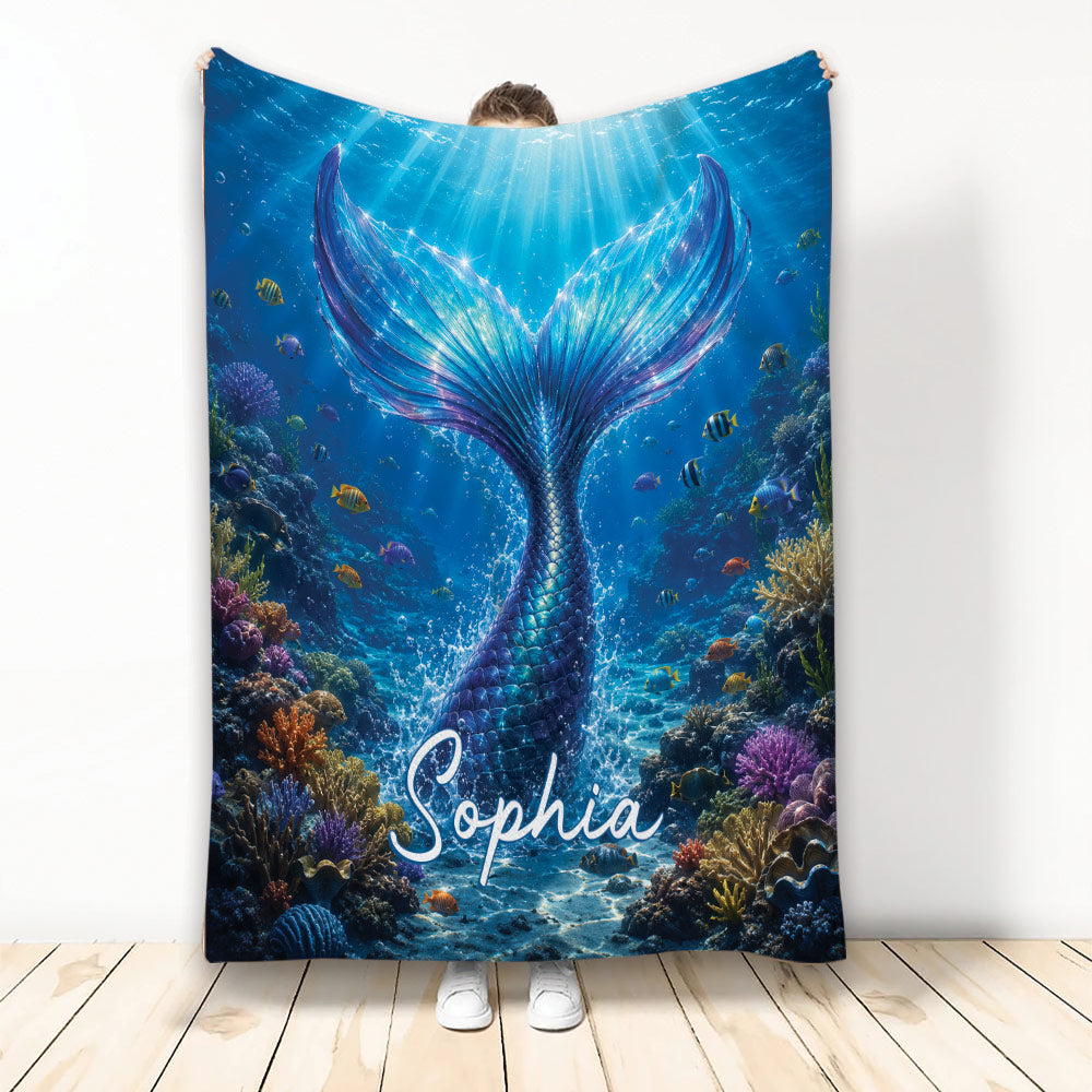 Mermaid throw blanket featuring a shimmering blue tail, tropical fish, coral reef, and underwater sunlight