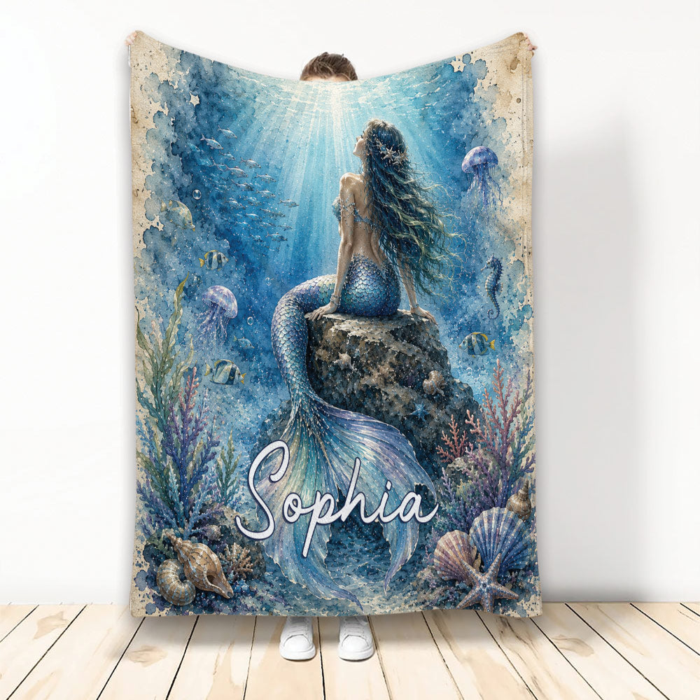 Mermaid blanket featuring an underwater watercolor scene with coral, fish, jellyfish, shells, and a mermaid