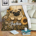 Pug blanket draped over a sofa with sunflower and wildflower artwork in a cozy living room setting