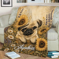 Decorative pug throw blanket displayed on a sofa with a sunflower meadow design and warm botanical colors