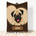 Pug throw blanket with a cheerful fawn-colored pug illustration in a brown stitched border
