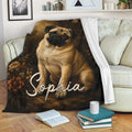 Pug throw blanket draped over a sofa with vintage floral dog artwork