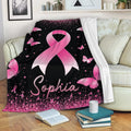 Breast cancer awareness ribbon throw blanket displayed on a sofa with pink butterflies