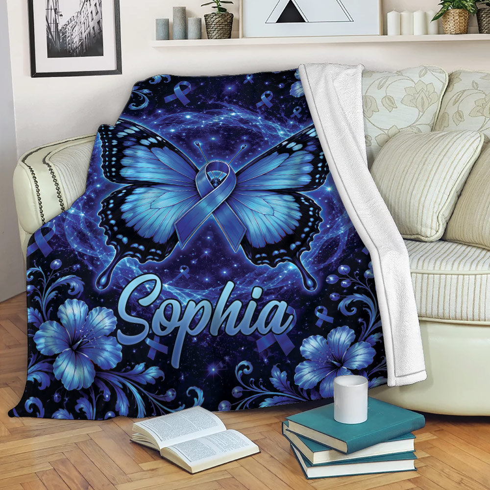 Blue diabetes awareness throw blanket displayed on a sofa with butterfly and ribbon artwork