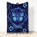 Blue butterfly diabetes awareness blanket with blue ribbons, floral accents, and cosmic artwork