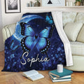 Diabetes awareness throw blanket displayed on a sofa with blue butterfly and ribbon artwork