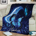 Blue butterfly diabetes awareness blanket draped over a sofa with moon and floral night-sky design