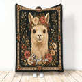 Floral alpaca throw blanket with a warm folk-art border and dark botanical background