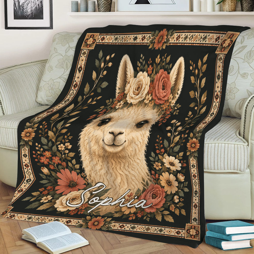 Floral alpaca blanket displayed across a sofa with botanical artwork and decorative border