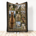 Alpaca throw blanket displayed upright with a collage of alpaca portraits and an earthy decorative border